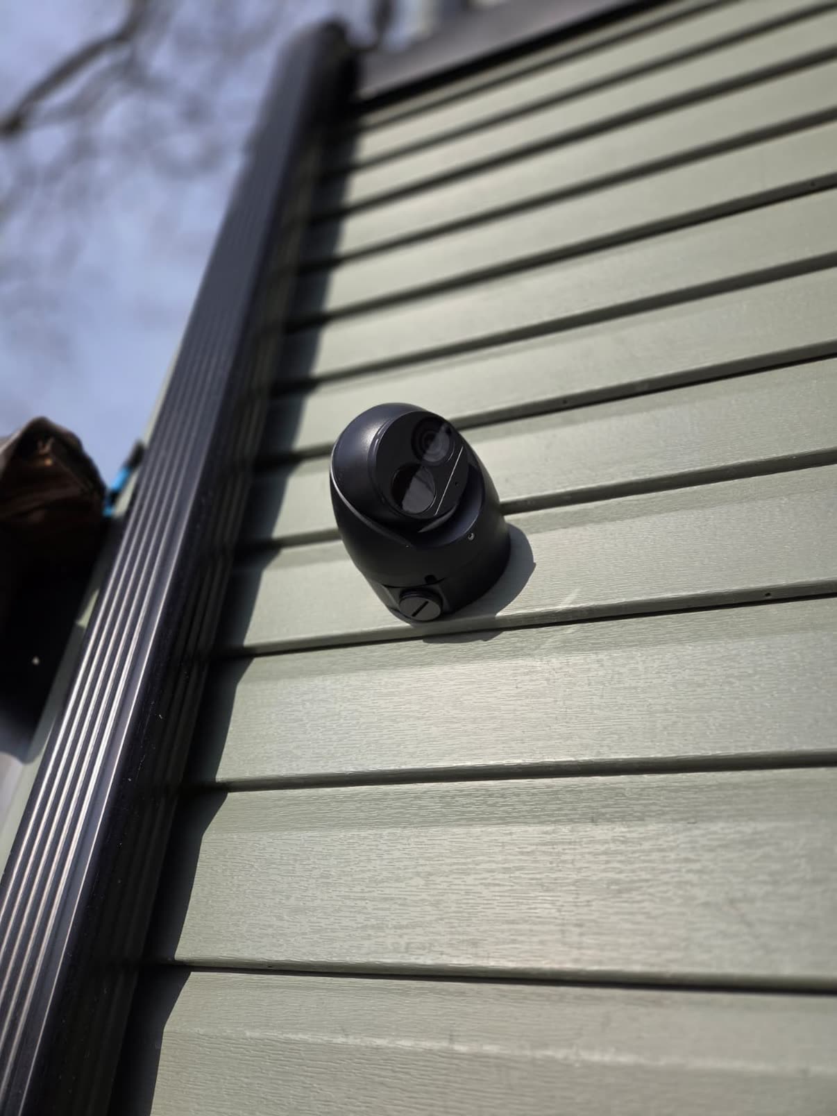 Camera on vinyl siding, low angle